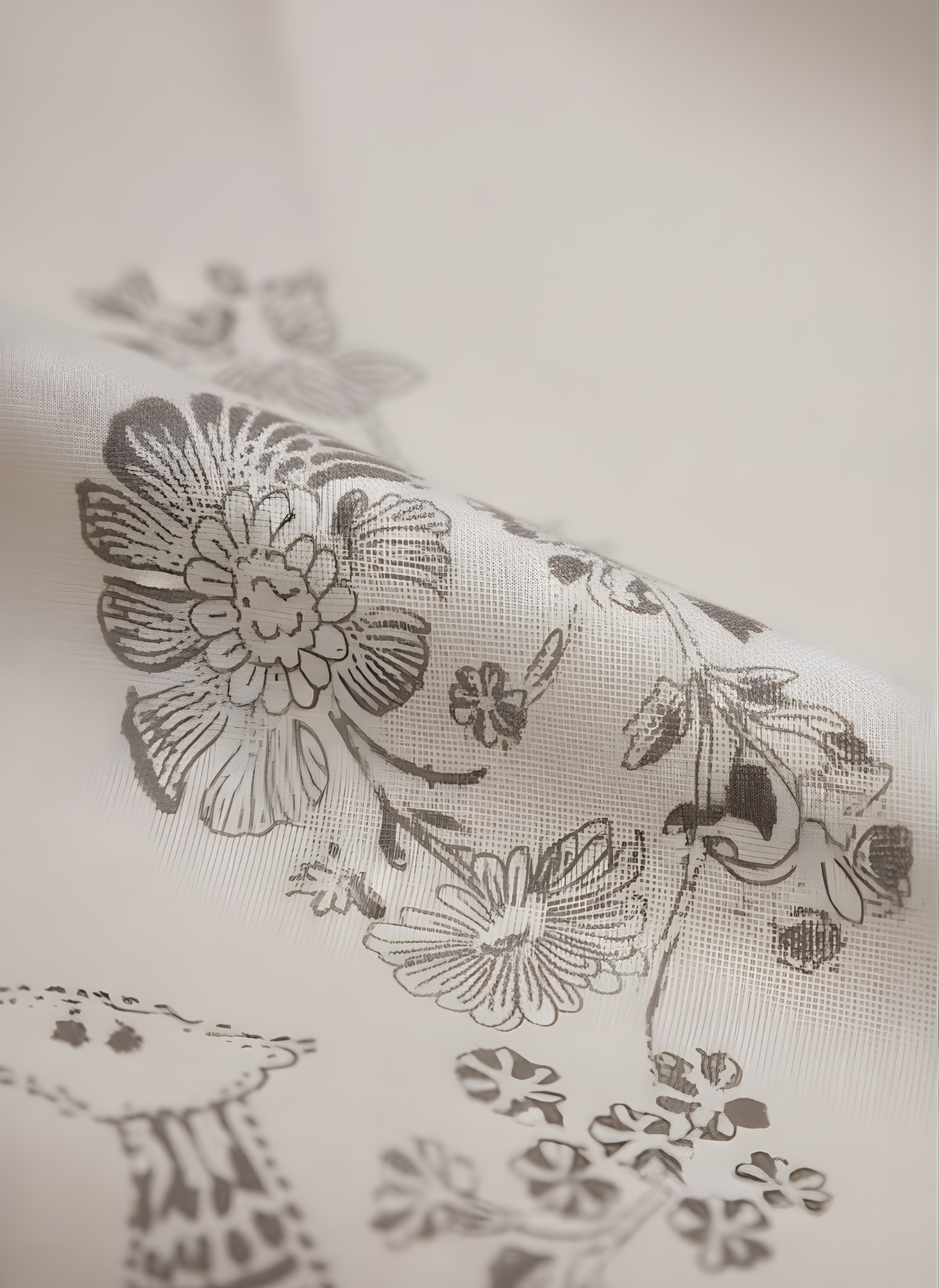 Floral patterned fabric with black ink on a white background