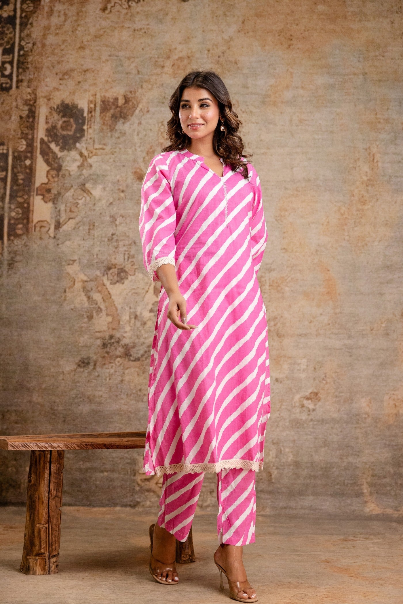 Woman wearing pink striped cotton kurta set